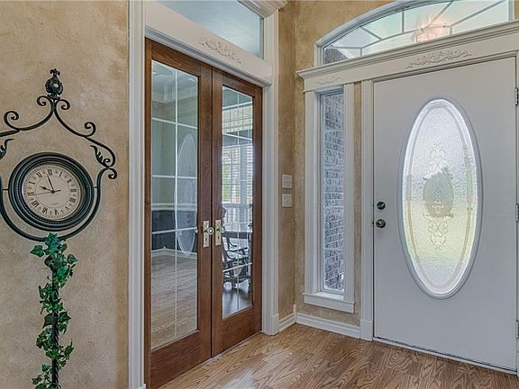 Front entry way and french doors leading into the office; the office has a closet & could be used for 4th bedroom