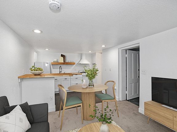 This image shows a virtually furnished space. This space come unfurnished.