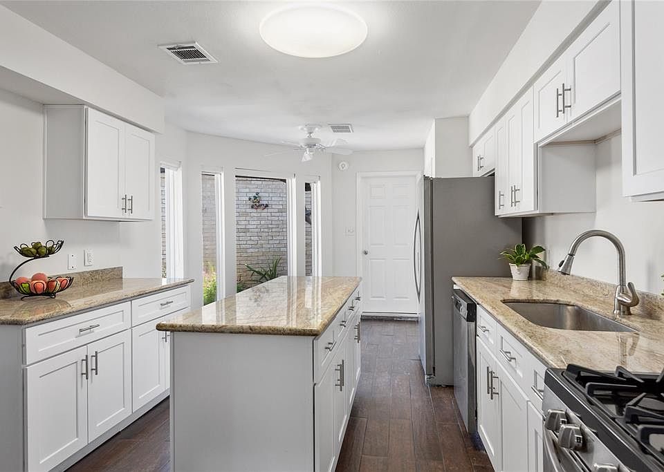 This fabulous townhome has so much to offer including plenty of updates like stainless appliances and gorgeous granite countertops.