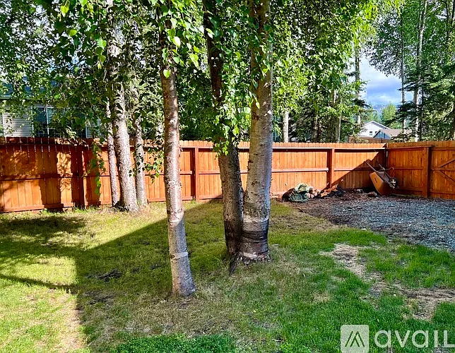 Backyard - Gravel Pad with large double wide gate to access from driveway. Garage mandoor opens directly to back yard.
