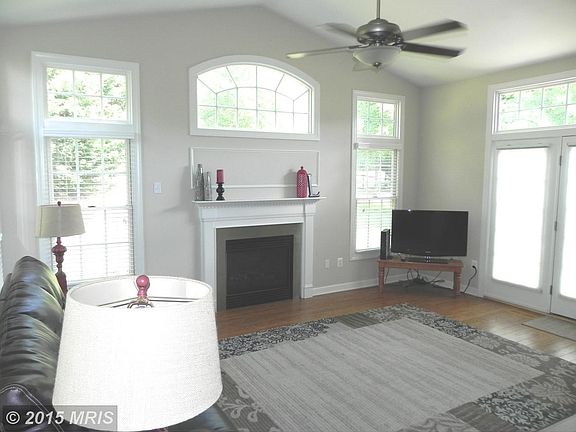 Family Room w/ FP & French doors to patio