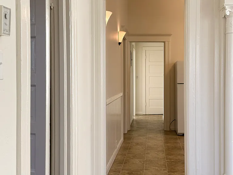 looking from inner living room through kitchen to hallway