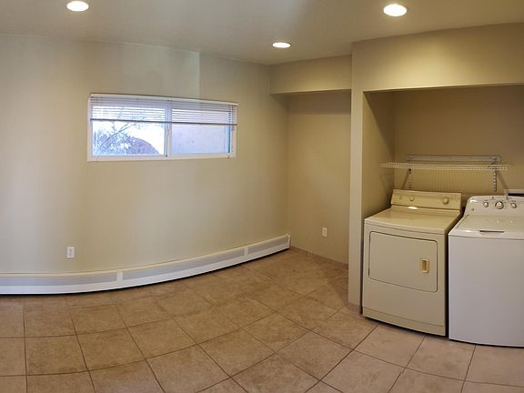 Downstairs spare room and laundry with washer and dryer (included with rental).