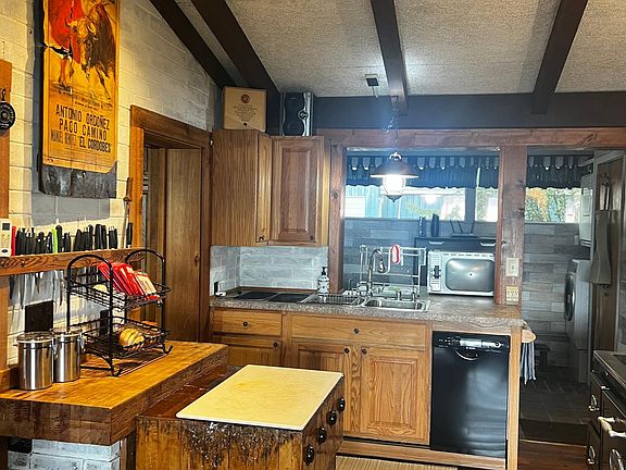 Antique chopping block makes the perfect work space and clean up is easy with the Bosch dishwasher
