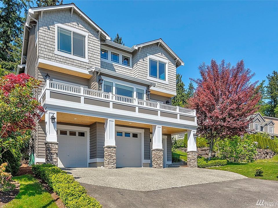 Top windows are master bedroom & bath. Mid level deck opens to great room & office. Lower level is 3 car garage with cabinets & storage area.