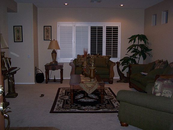 Large living room with warm color paint on walls