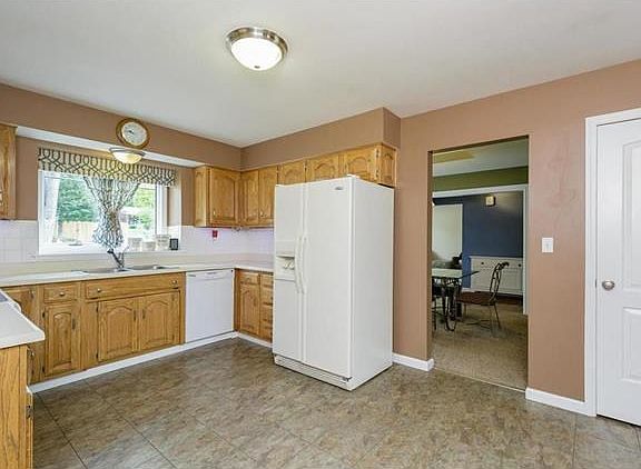 Eat-in Kitchen with smooth-top range, pantry, newer fixtures & hardware, newer dishwasher plus newer