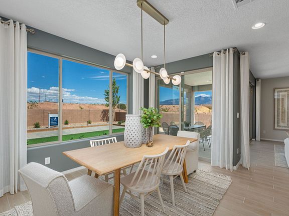 The cafe is brightly lit thanks to the large window and sliding glass door to the backyard.