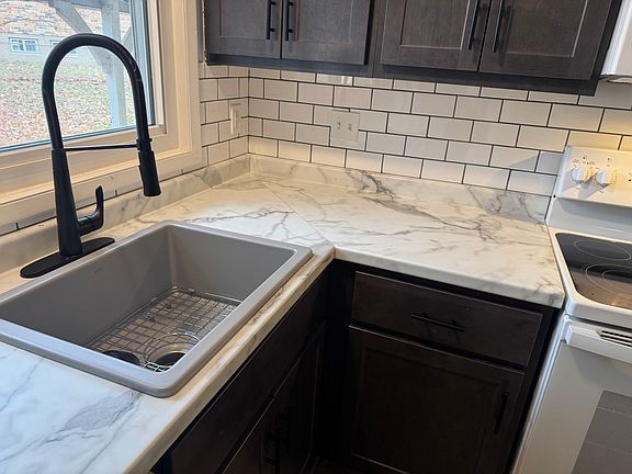 Brand new cabinets, countertop, sink, faucet, disposal