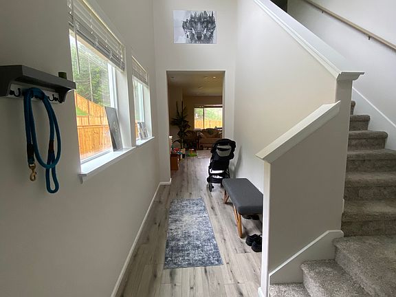 Entry way with views of the forest and natural lighting