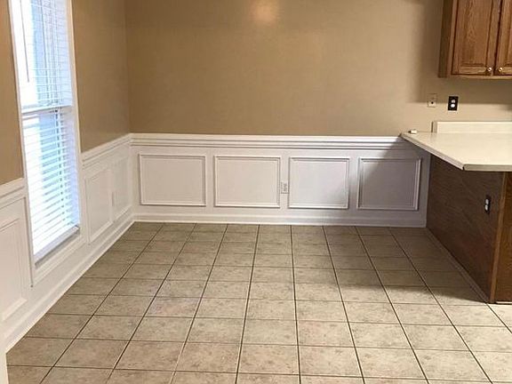 Breakfast area with bar- includes 2 bar stools (not shown)