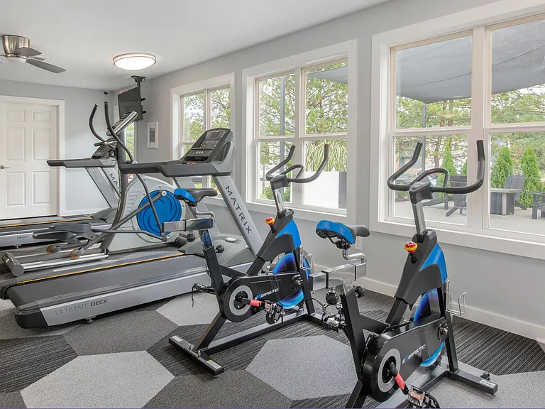 Maintain your fitness routine with access to treadmills and stationary bikes in our dedicated fitness room, professionally operated by Highlands Vista Group.