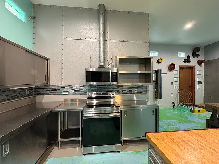 Steampunk, industrial decor theme..stainless steel commercial cabinets