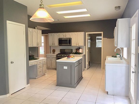 The spacious kitchen offers an island and plenty of cabinet space! There is a large walk-in pantry as well.
