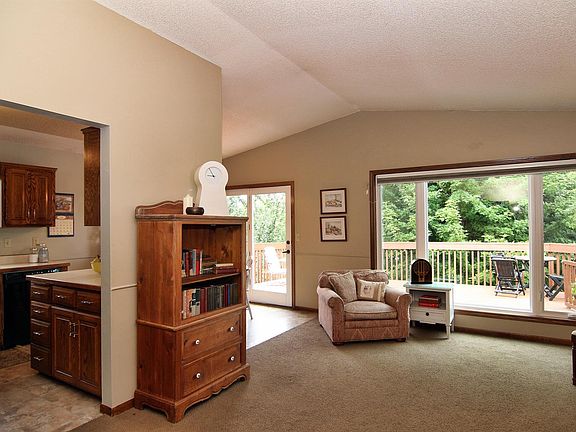Vaulted ceilings bridge the living, dining kitchen areas