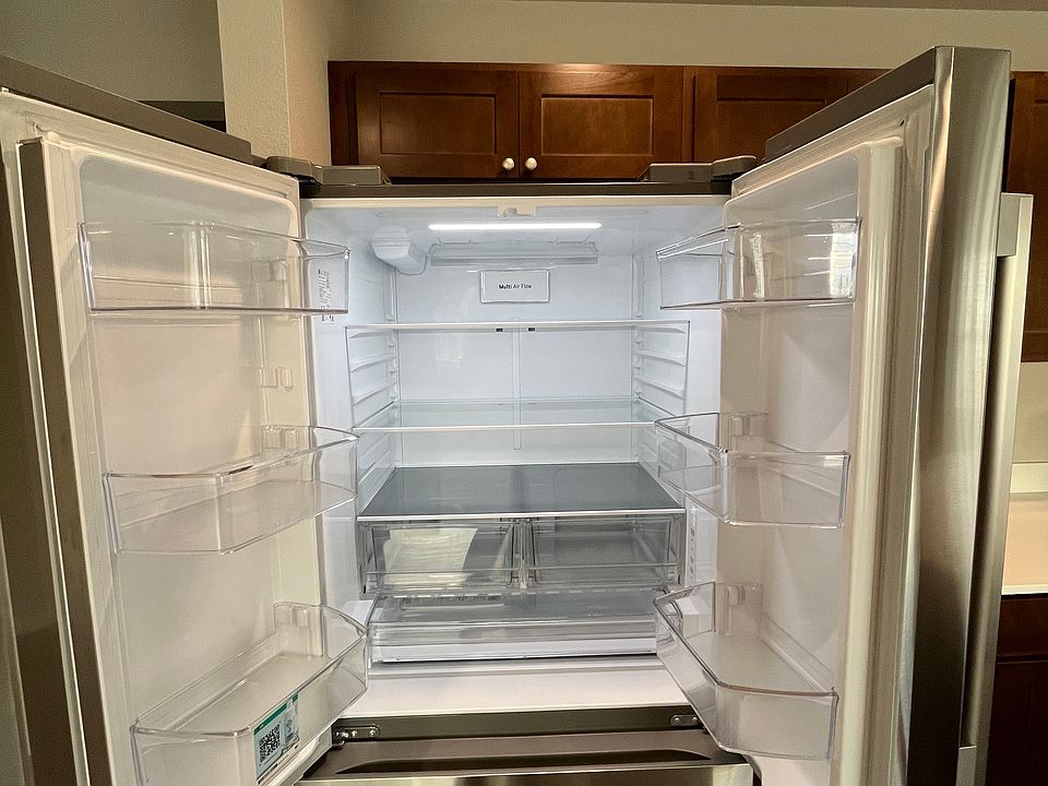 Full-size refrigerator with in-door organizer and produce/cheese/meat organizer.