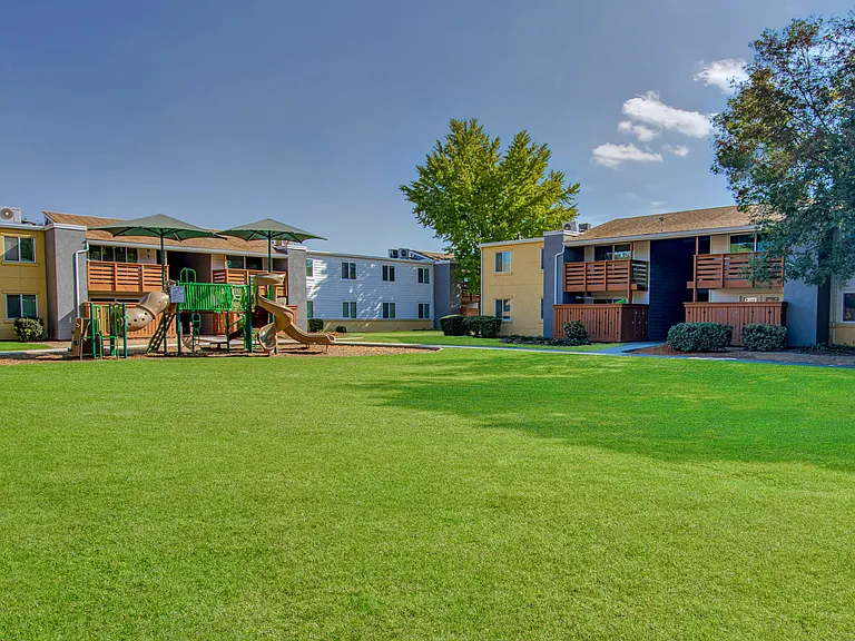 Expansive green spaces with a community playground.