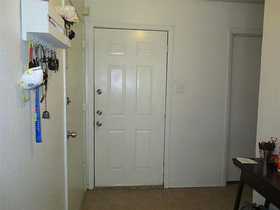 Enter to Vinyl flooring for easy care, garage to the left in this pictures, utility room to the right.