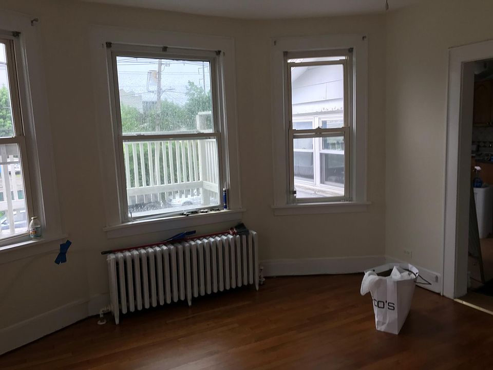 living room with three beautiful and large windows. 