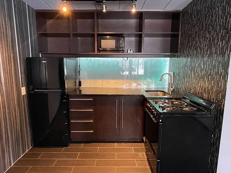 Elevate your culinary skills in the modern kitchen of LS Capital Group. With sleek cabinetry and state-of-the-art appliances, every meal is a delight. Don't miss out on making this space your owna"schedule a visit today!