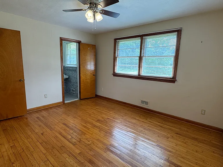 Primary bedroom with private half bath.