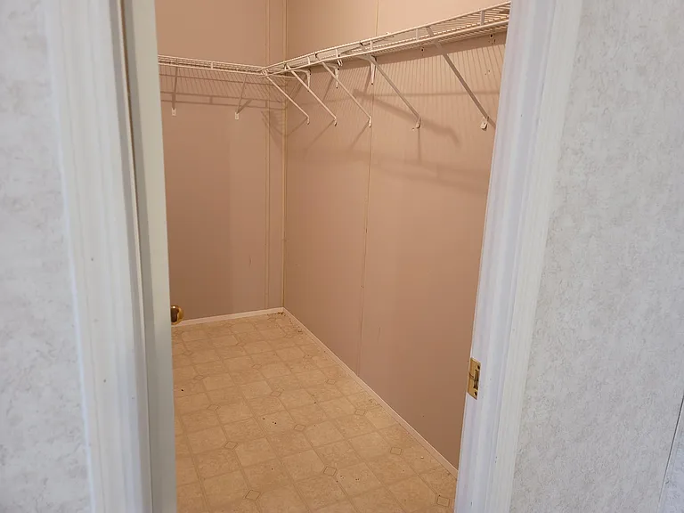 Walk in closet in master bedroom