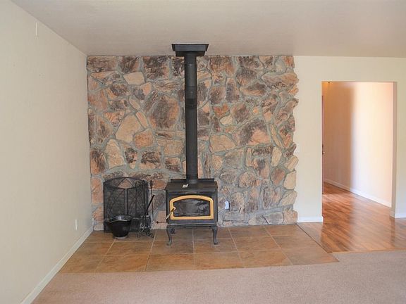 Wood burning stove in living room.