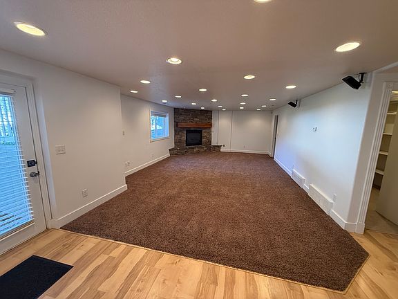 Looking left from the entrance shows living room and thermostat controlled fireplace