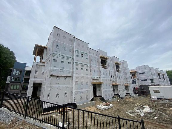 Construction trailer right side of pic will be moved and whole front of building landscaped. Unit