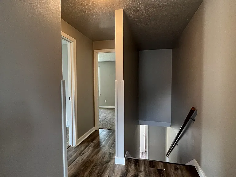 Hall, from bathroom towards stairs and bedrooms