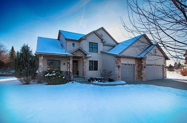 Classic stucco and stone beauty on large private cul-de-sac lot. Cement driveway