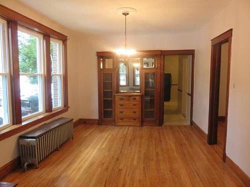 Dining room with bedroom off to the right.