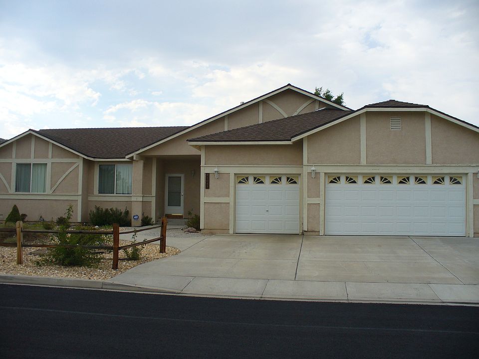 Front, showing 3 car garage faces south