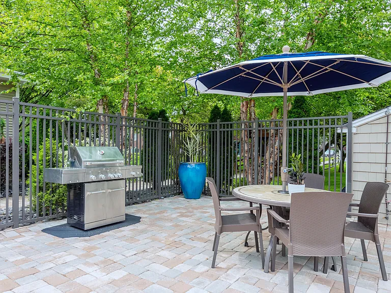 Enjoy a poolside BBQ feast with our sleek gas grill and shaded seating.