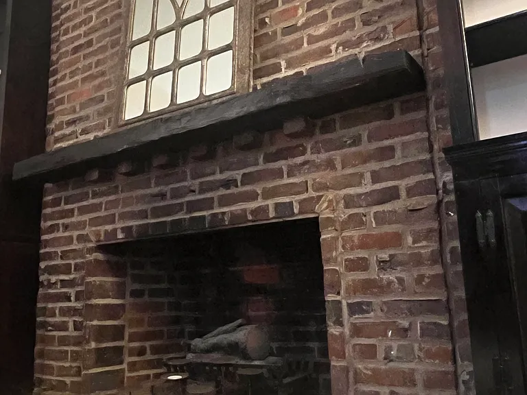 Brick fireplace with mantle - with electric fire logs provided