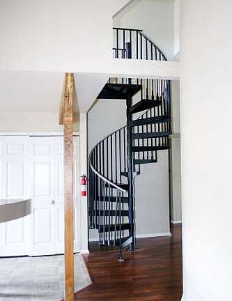 Spiral staircase to upper 2nd living area, 5th room/loft area.