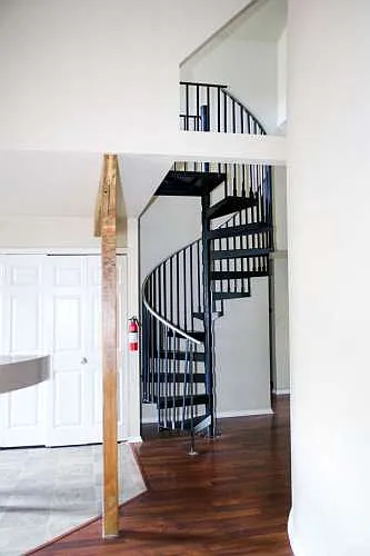 Spiral staircase to upper 2nd living area, 5th room/loft area.