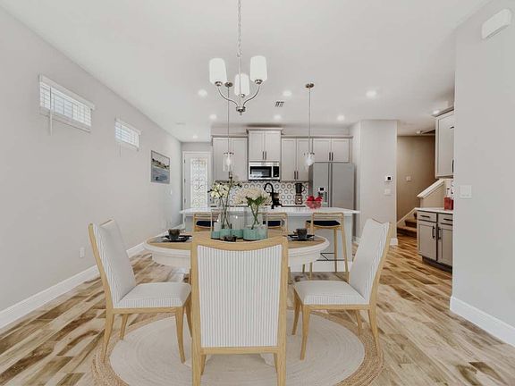 Jewel luxury new construction paired villa in Sun City Center, FL cafe and kitchen area by William R