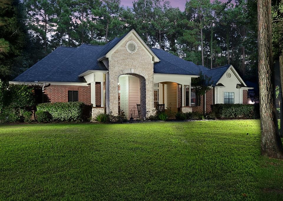 Located on a wooded acre in gated Thousand Oaks with easy access to The Woodlands.