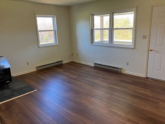 living room (pic from upstairs unit to see new flooring-same in both)