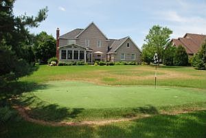 Artificial putting green at the rear of property