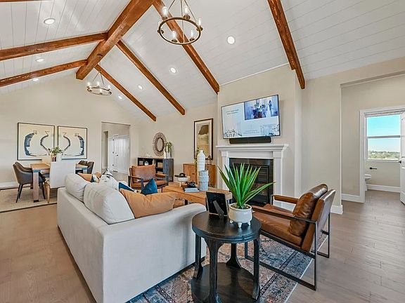 Great room with stained ceiling beams