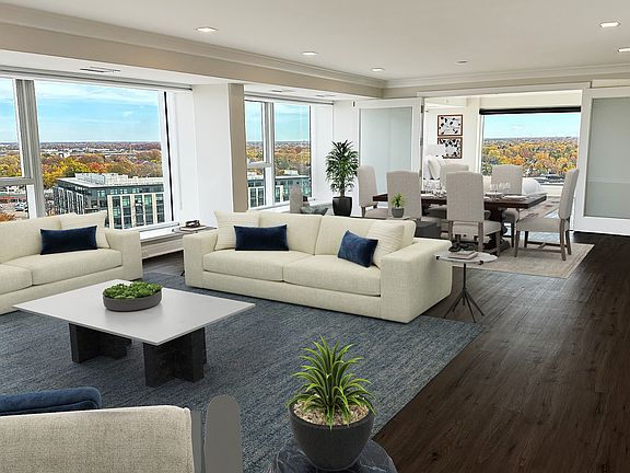 HUGE LIVING ROOM FABULOUS VIEWS TO THE DETROIT SKYINE AND CANADA, WOOD FLOORS 37FT. OF FLOOR TO CEILING WINDOWS