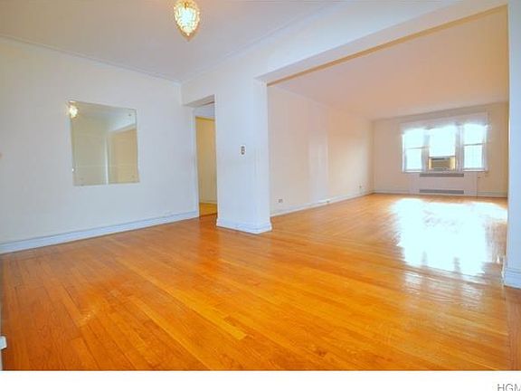 Large Sunny Living Room and Dining Foyer have hardwood floors and Southern Exposures.  The living room is 23'-0" x 13'-6" and the Dining Foyer is 15'-6" x 9'-0"