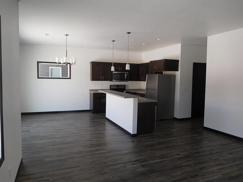 Open Concept living room, dining room, and kitchen. Brand new with stainless steel appliances.