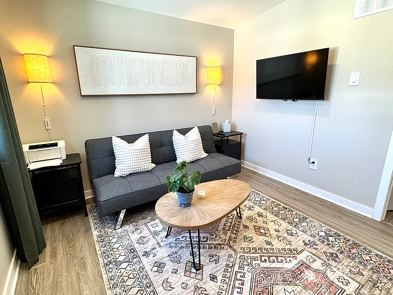 Dedicated office and den area for remote workers with 40" smart TV in this furnished midterm rental in Ottawa.