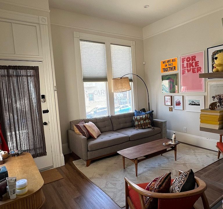 Living room w/ lots of light from three windows, recessed lighting, tall ceilings, smart entry lock