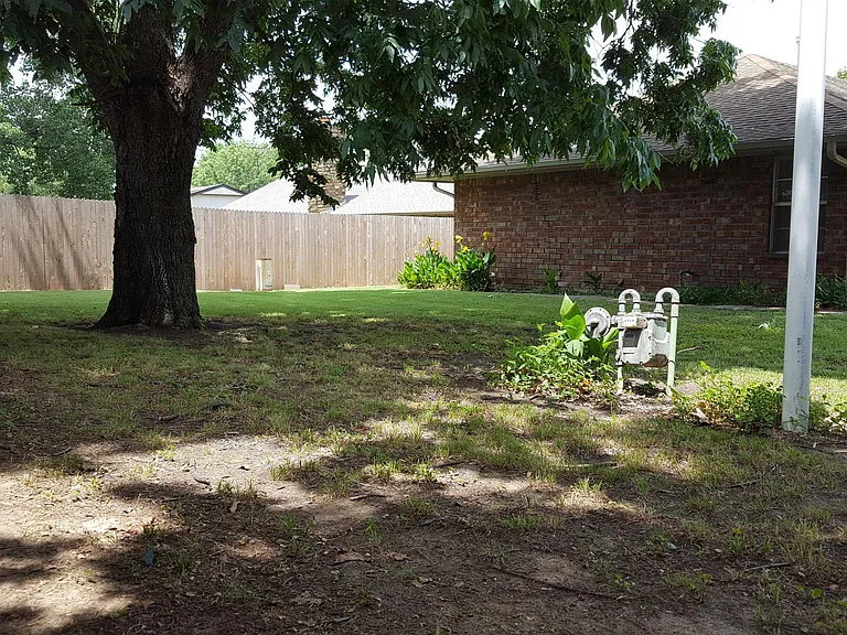 LARGE PRIVACY FENCED BACK YARD WITH LOCKING GATE.