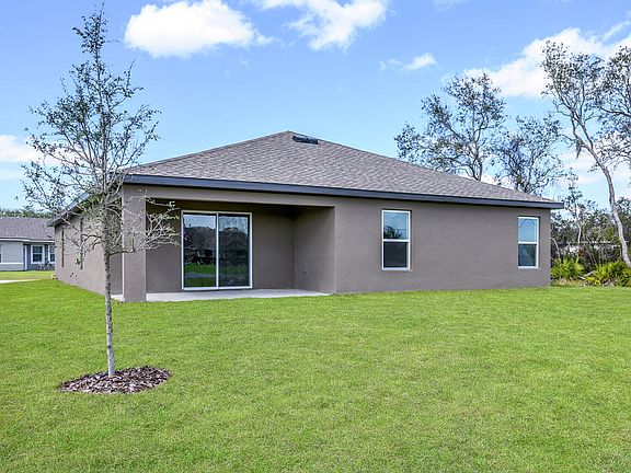 The back patio has a sliding glass door leading into the family room