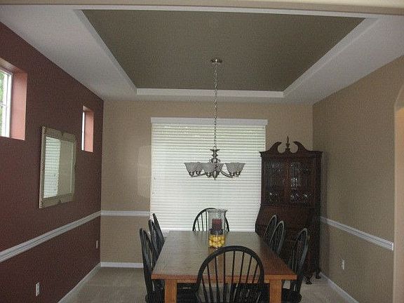 Formal dining room with tray ceiling